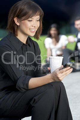 Woman Texting and Drinking Coffee