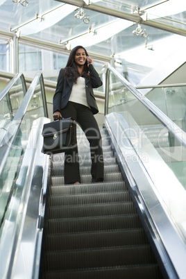 Businesswoman on an Escalator