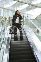 Businesswoman on an Escalator