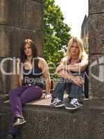 Girls sitting on a wall