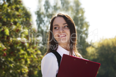 Young woman  with plane smile  in park