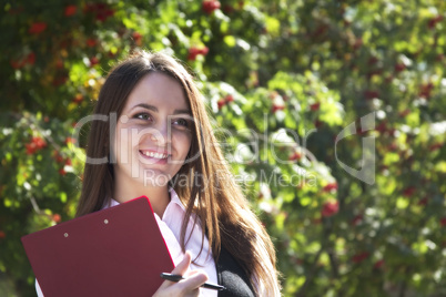 Young woman  with plane smile  in park