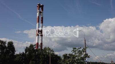 Tube on cloudy sky and trees timelapse