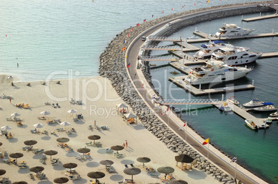 Yacht parking near luxury hotel and beach, Dubai, UAE