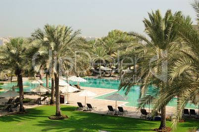 Swimming pool recreation area in luxurious hotel, Dubai, UAE
