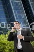 Businessman Talking On His Cell Phone In A Modern City