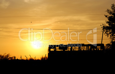 Last bus on a sunset