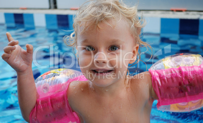 Little girl in swimming pool