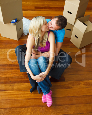 Couple moving to new house and kissing each other