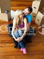 Happy young couple sitting on floor. Moving house