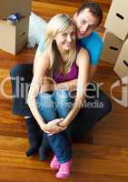 Couple sitting on floor. Moving house