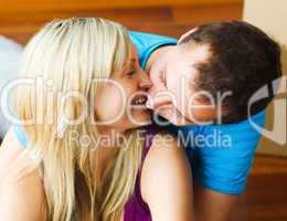 Close-up of couple moving to new house and kissing