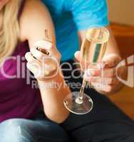 Close-up of a key and a glass of champagne. Concept of buying ho