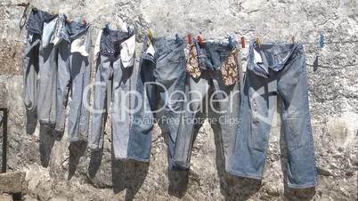 Hanging jeans trousers drying