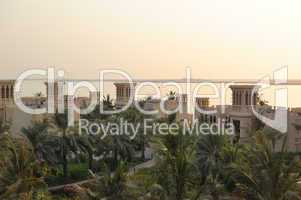 Sunset in luxurious hotel and view on Deira Palm construction, D