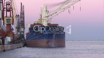 Time lapse cargo ship moving load