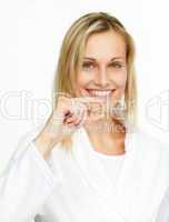 woman holding a yellow pill