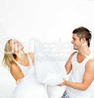 couple having a pillow fight