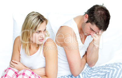 Couple sitting in bed