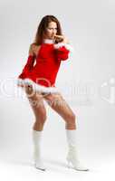 Dancing girl in red on light background