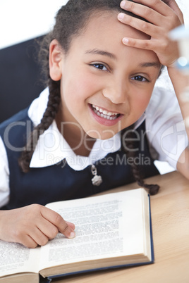 Young School Girl Reading A Book