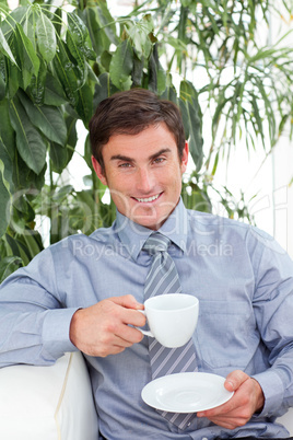 Businessman drinking a cup of coffee