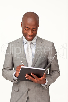 Attractive businessman writing notes