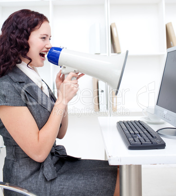 Businesswoman with a megaphone