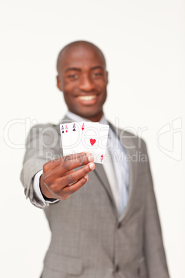 businessman holding four aces