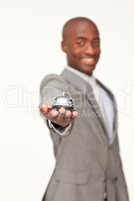 businessman holding a hotel bell