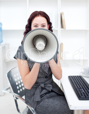 Businesswoman with a megaphone