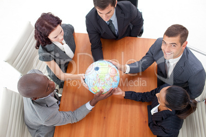 businessteam holding a globe