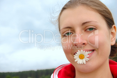 The girl with chamomile in teeth