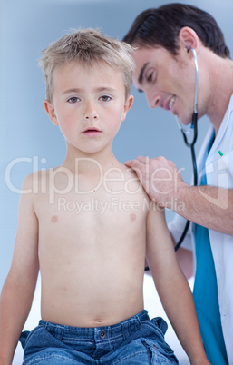 Doctor examinating a child with stethoscope