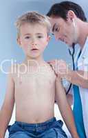 Doctor examinating a child with stethoscope
