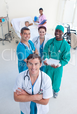 High view of medical team with a child in bed