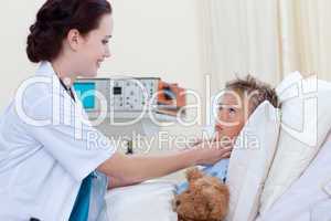 Female doctor examining child throat