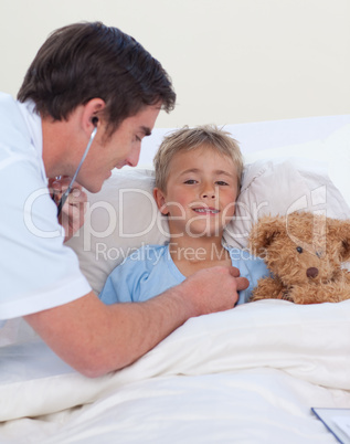 Doctor listening to a child chest with stethoscope
