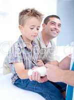 Bandaging an arm injury on a child