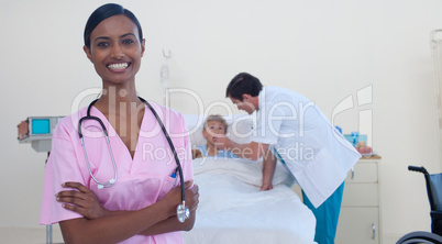 Beautiful asian nurse with doctor and patient