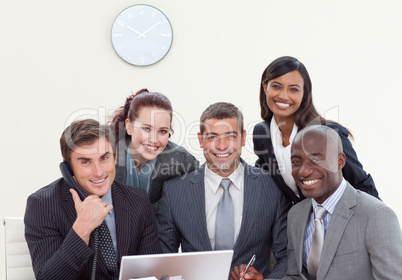 Group of people smiling in a business meeting