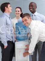 Busines colleagues talking around water cooler