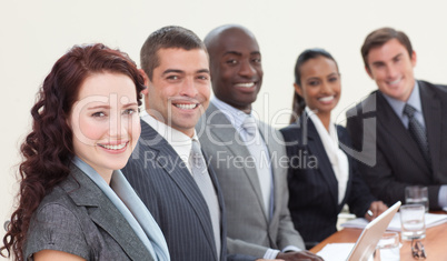 Business people sitting in a meeting and smiling