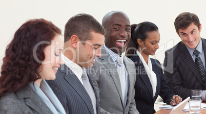 Happy businessman working in a meeting