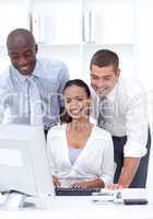 Two businessmen and businesswoman working together