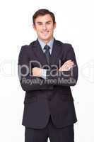 Confident businessman with folded arms smiling