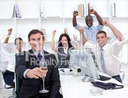 Successful businessteam driking champagne in office