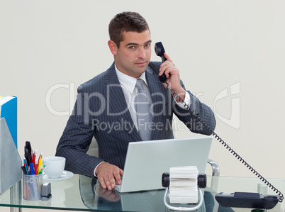 Serious businessman phone in his office