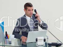 Serious businessman phone in his office