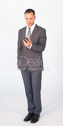 Isolated businessman writing a message with a mobile phone